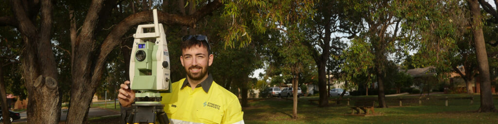 Surveyor performing topographical land survey in Perth, Western Australia