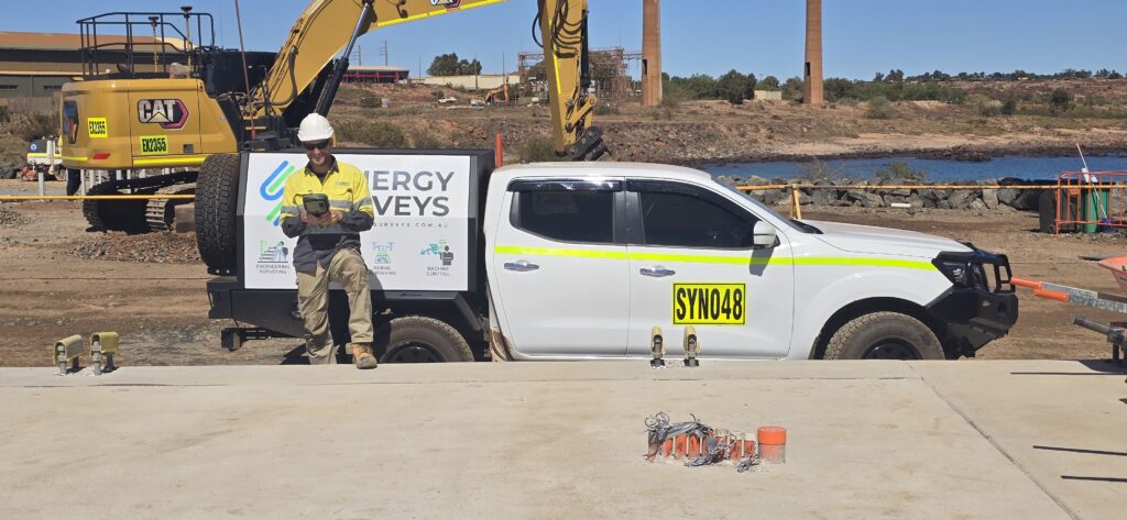 Construction surveyor operating machine control and GNSS surveying equipment in Karratha, Western Australia